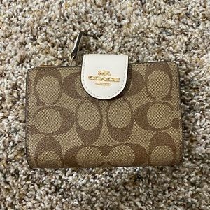 Coach small monogram wallet.
